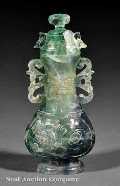 Appraisal: A Chinese Carved Green Quartz Covered Vase of flattened bottle