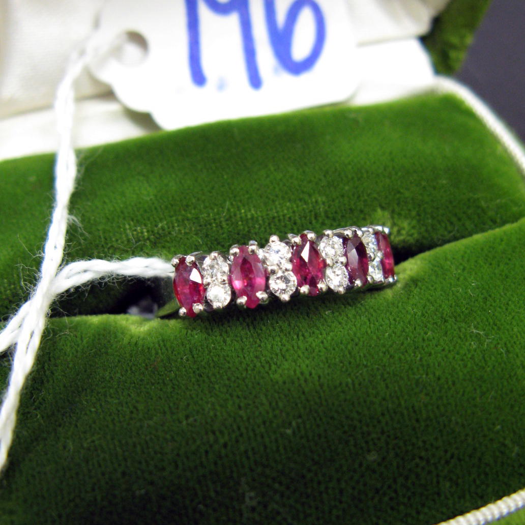 Appraisal: RUBY DIAMOND AND EIGHTEEN KARAT WHITE GOLD RING Five marquise-cut