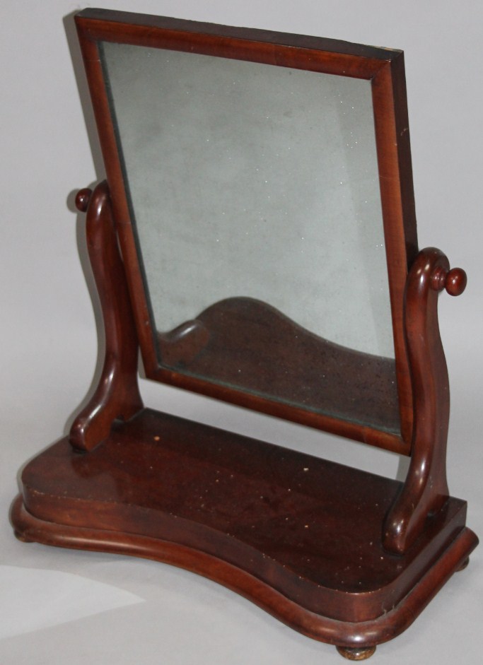 Appraisal: A Victorian mahogany table mirror the rectangular glass held on