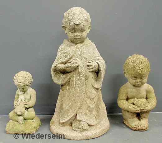 Appraisal: Three cast stone garden figures Tallest h