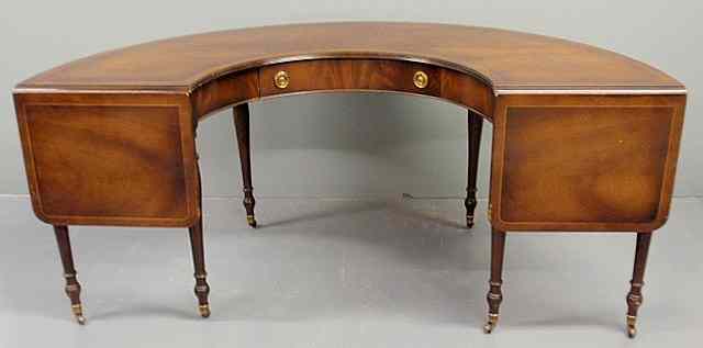 Appraisal: Sheraton style mahogany curved hunt table with drop leaves and