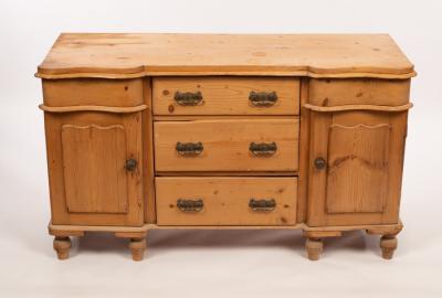 Appraisal: A pine dresser base fitted cupboards and drawers on turned