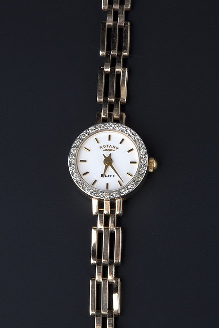 Appraisal: A lady's ct gold and diamond set Elite wristwatch by