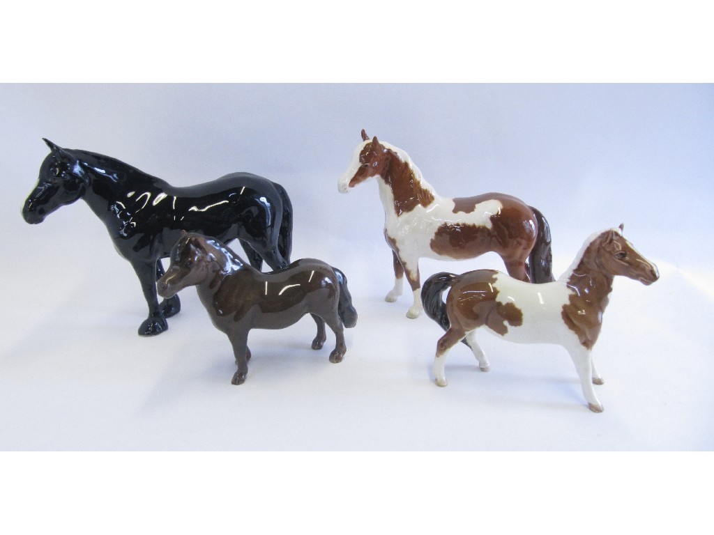 Appraisal: Four Beswick horses including Shetland Skewbald pony 'Eschonchan Ronay' Pinto