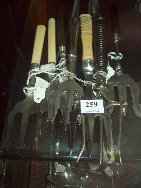 Appraisal: A COLLECTION OF SEVEN IVORY AND WOODEN HANDLED SERVING FORKS