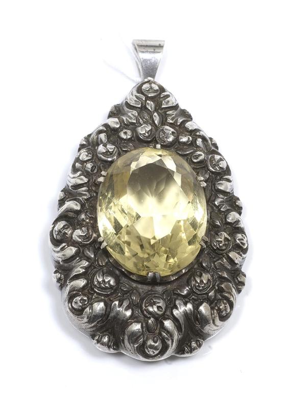 Appraisal: A CITRINE PENDANT circa Silver Decorative drop shape pendant with