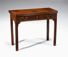 Appraisal: George III mahogany games table The rectangular top opening to