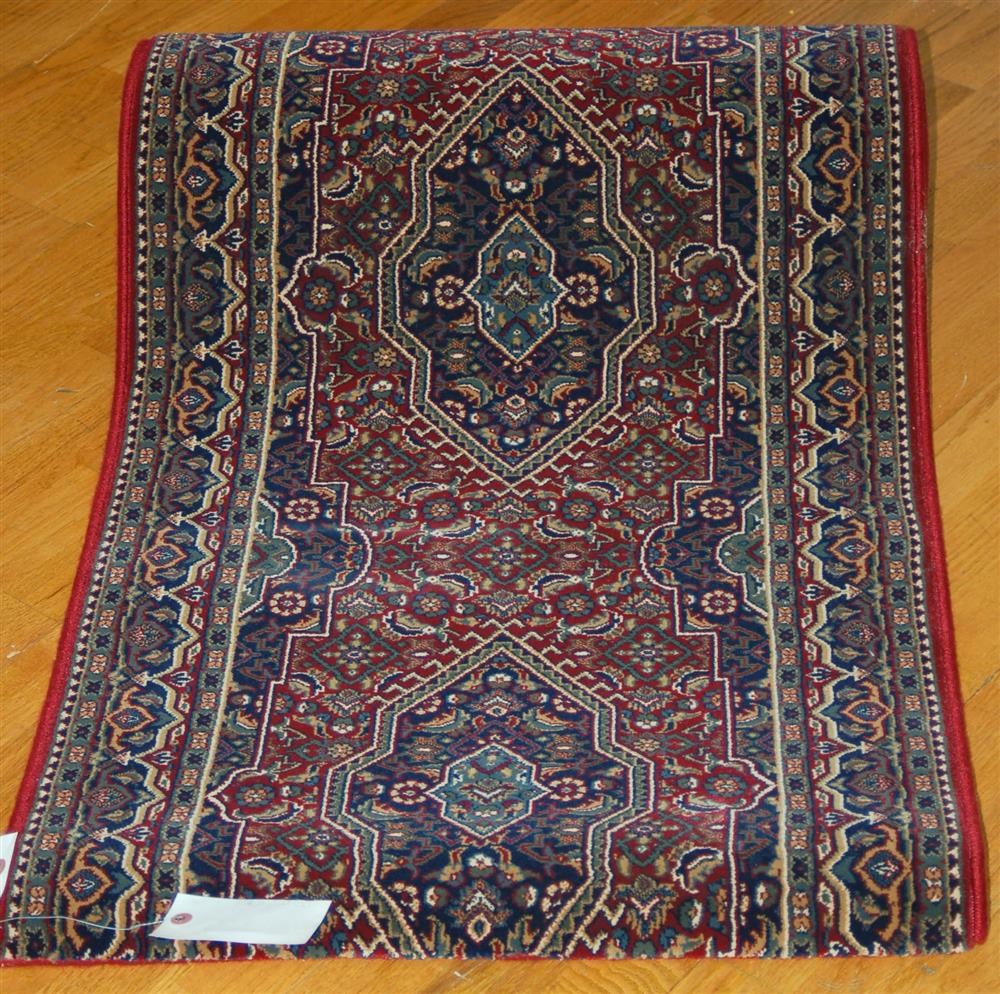 Appraisal: ROYAL MILLENIUM ORIENTAL RUNNER consisting of colors in red navy