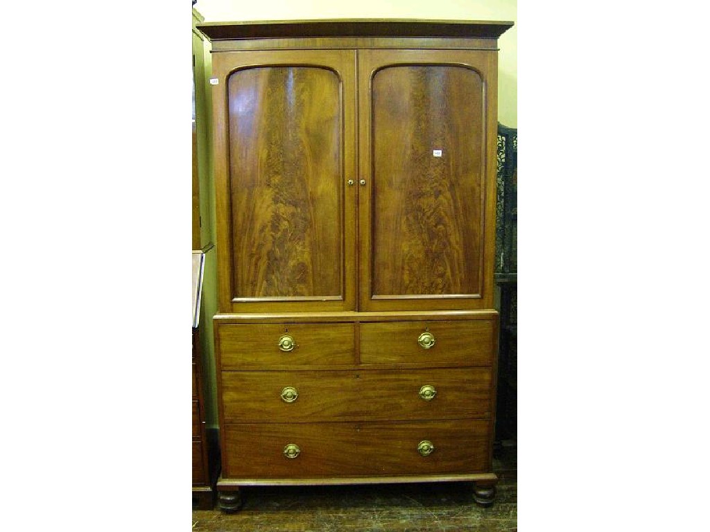 Appraisal: A Victorian mahogany linen press the upper section enclosed by