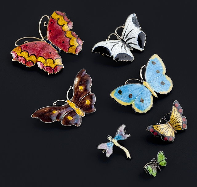 Appraisal: A collection of enamel butterfly and panel brooches comprising six