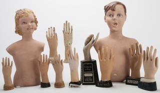 Appraisal: Ten Display Advertising Hands and Mand and Woman Hanging Plaster