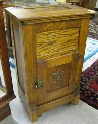 Appraisal: PETITE ASH WOOD ICEBOX American c having a lift top