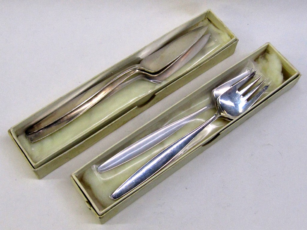 Appraisal: Set of three sterling silver cake knives and forks by