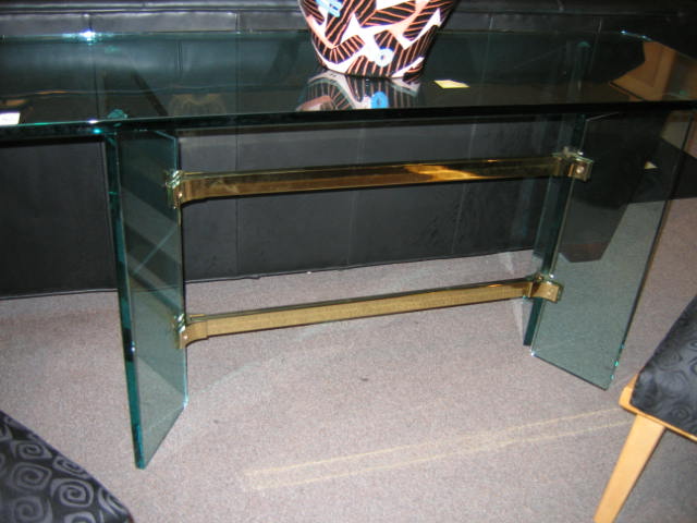 Appraisal: GLASS CONSOLE TABLE shaped top raised on a pair of