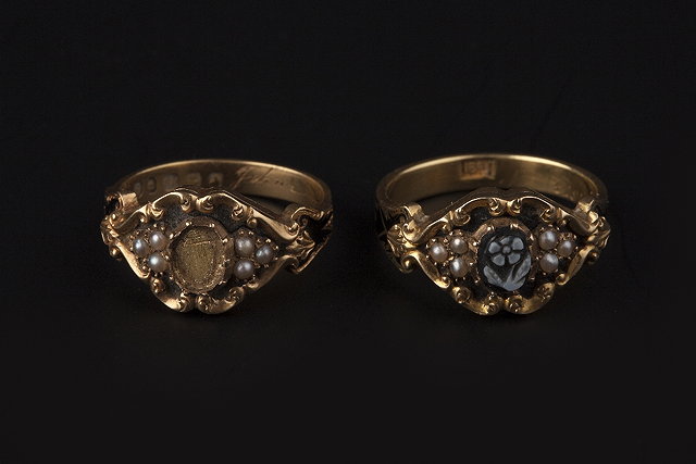 Appraisal: A PAIR OF VICTORIAN MEMORIAL RINGS the first with floral