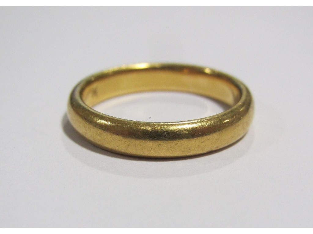 Appraisal: Twenty two carat gold wedding band Approximately gms