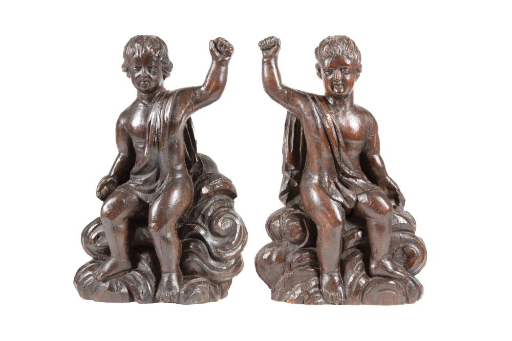 Appraisal: Pair of Continental Carved Walnut Putti th c seated on