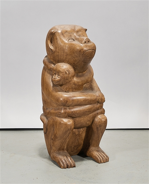 Appraisal: Chinese carved wood monkey sculpture holding baby monkey in arms