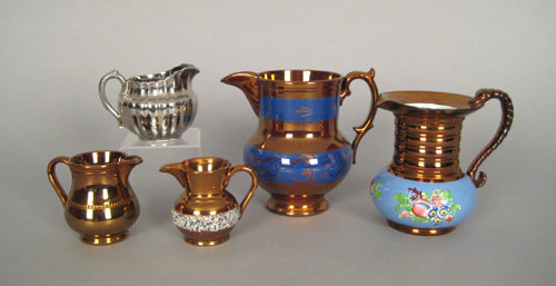 Appraisal: Four copper luster pitchers one with blue relief molded band