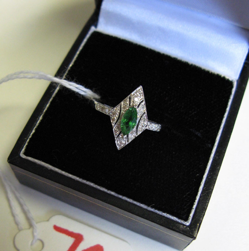 Appraisal: TSAVORITE GARNET DIAMOND AND EIGHTEEN KARAT WHITE GOLD RING centering