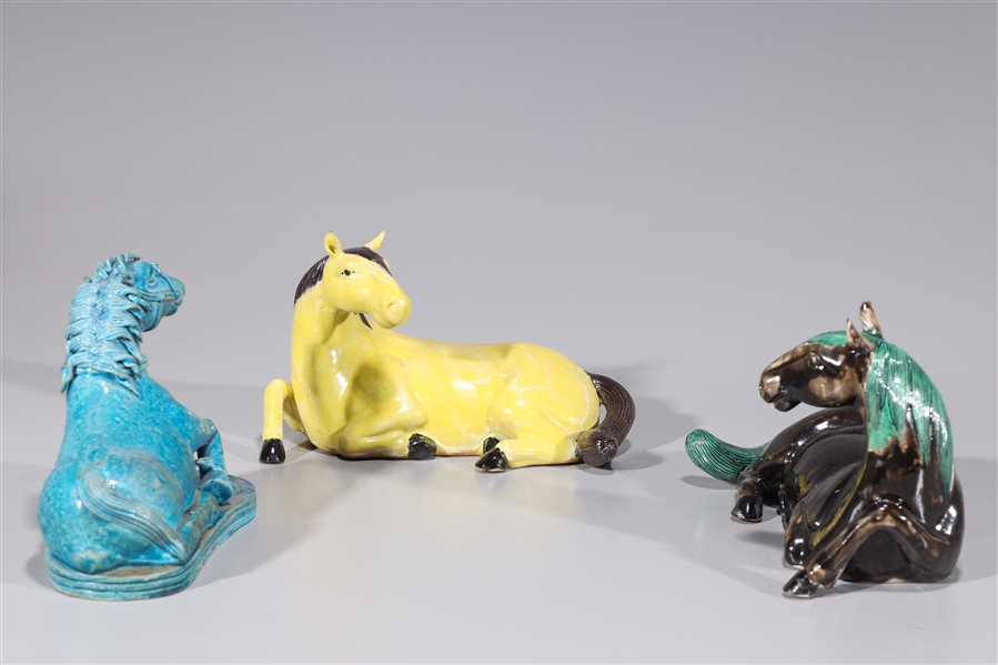 Appraisal: Group of three glazed ceramic horses various colors overall good