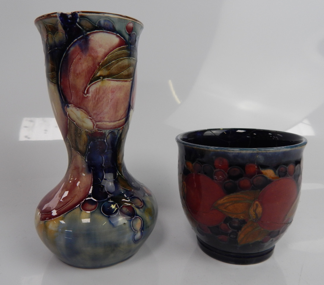 Appraisal: A Moorcroft vase with slightly flared waisted neck decorated with