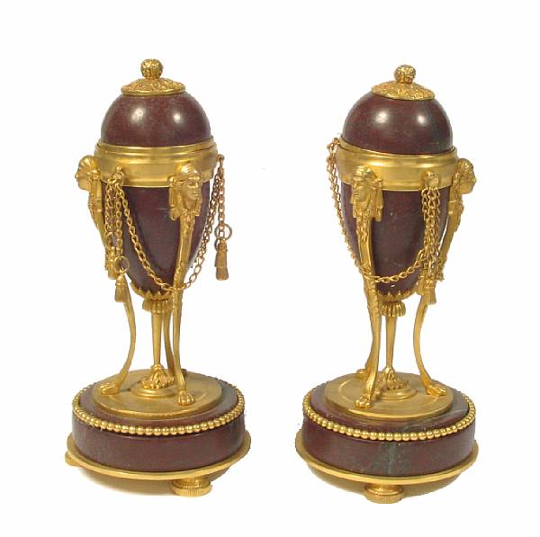 Appraisal: A pair of Empire style bronze and marble cassolettes height