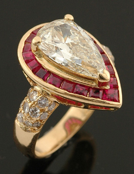 Appraisal: A diamond and ruby ring The claw set pear cut