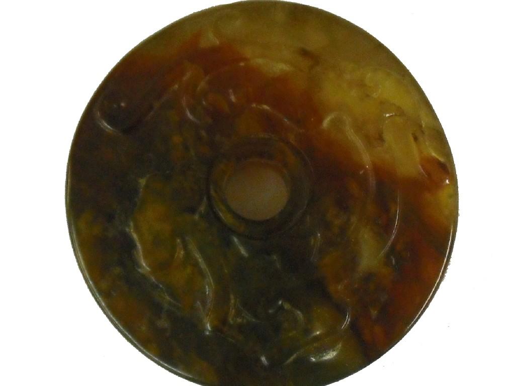 Appraisal: Chinese circular jade disc with relief decoration diameter