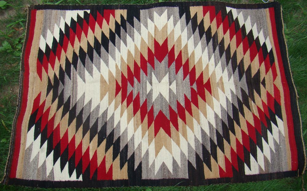 Appraisal: NAVAJO BLANKET In Eye Dazzler design Approximately x Late th