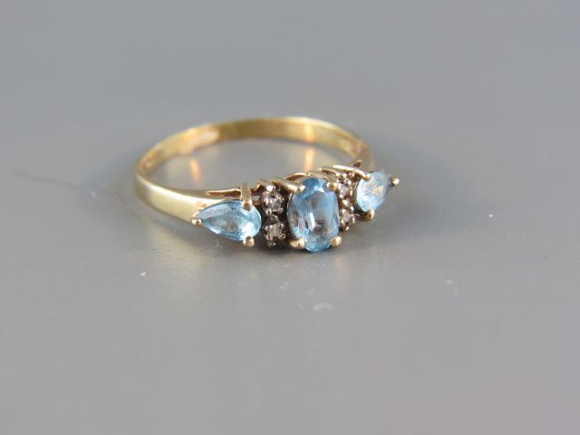 Appraisal: Blue Topaz and Diamond Ring a trio of gems highlighted