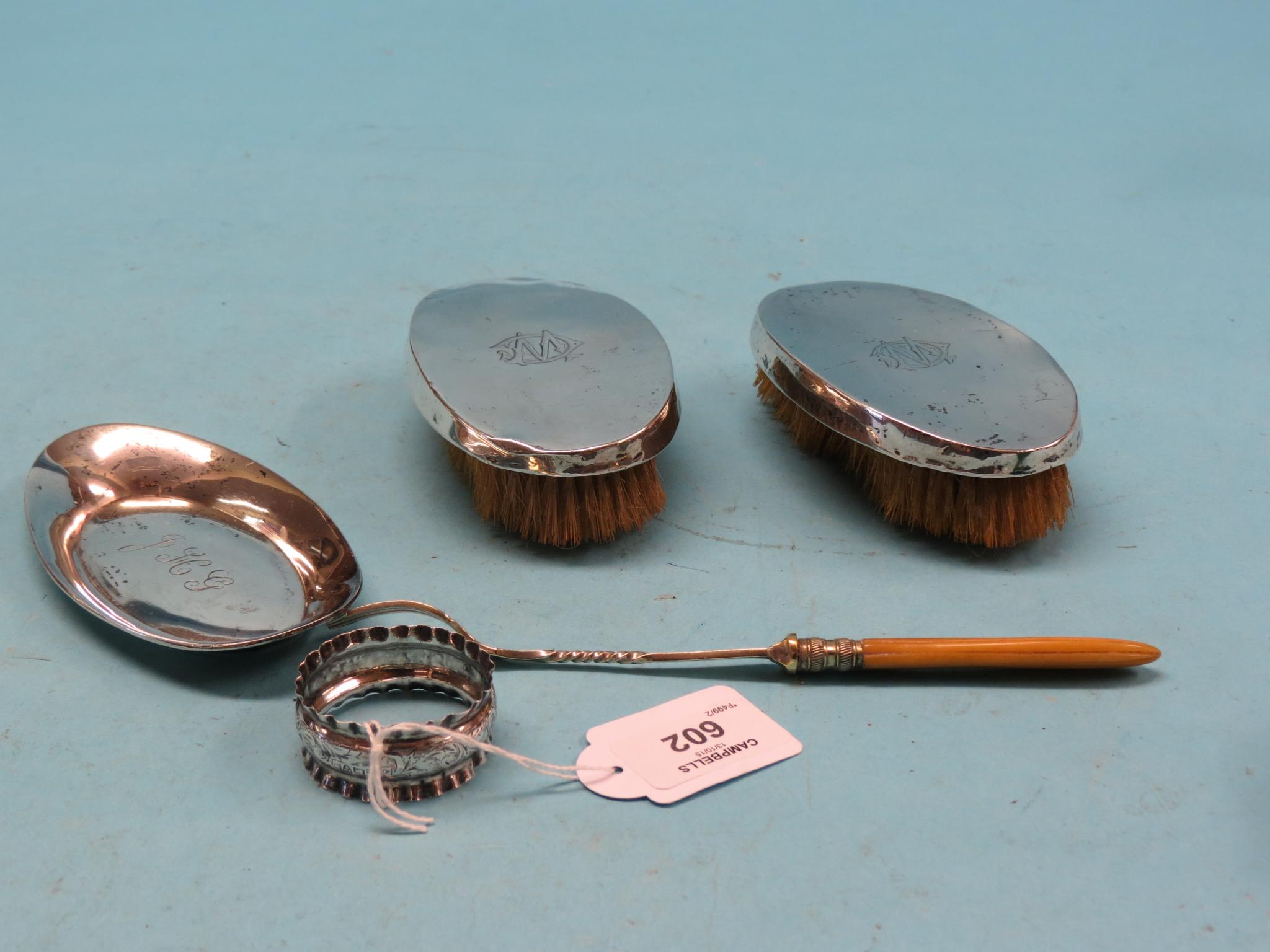 Appraisal: A pair of silver clothes brushes Birmingham an oval silver