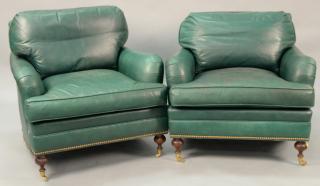 Appraisal: Pair of green leather easy chairs some soiling Pair of