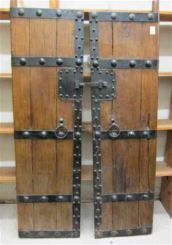 Appraisal: PAIR OF HARDWOOD AND FORGED IRON ENTRY DOORS Chinese th