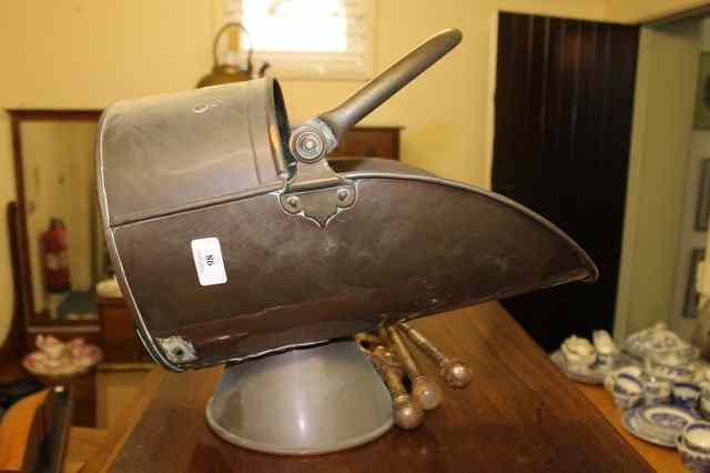 Appraisal: A COPPER HELMET SHAPED COAL SCUTTLE