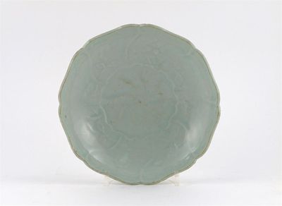 Appraisal: A Chinese Qingbai mallow-shaped dish moulded with a central spiral