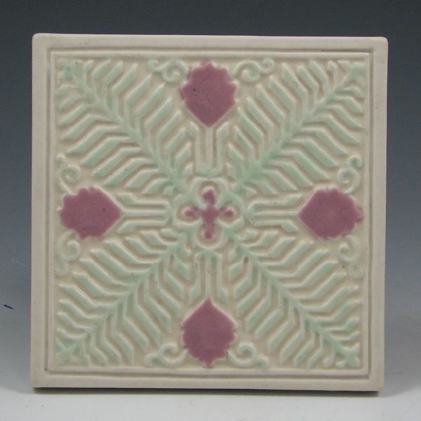 Appraisal: Rookwood trivet from with floral and fern design Marked with