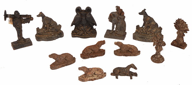 Appraisal: A GROUP OF TWELVE VARIOUS VICTORIAN CAST IRON DOOR PORTERS