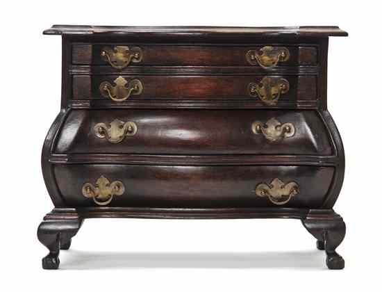 Appraisal: A Mahogany Miniature Bombe Form Chest of Drawers circa likely