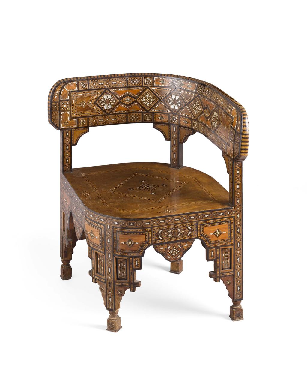 Appraisal: MIDDLE EASTERN INLAID CORNER ARMCHAIR LATE TH CENTURY the shaped