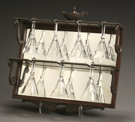 Appraisal: Fourteen Irish Crystal Stirrup Glasses and Pair of Display Shelves