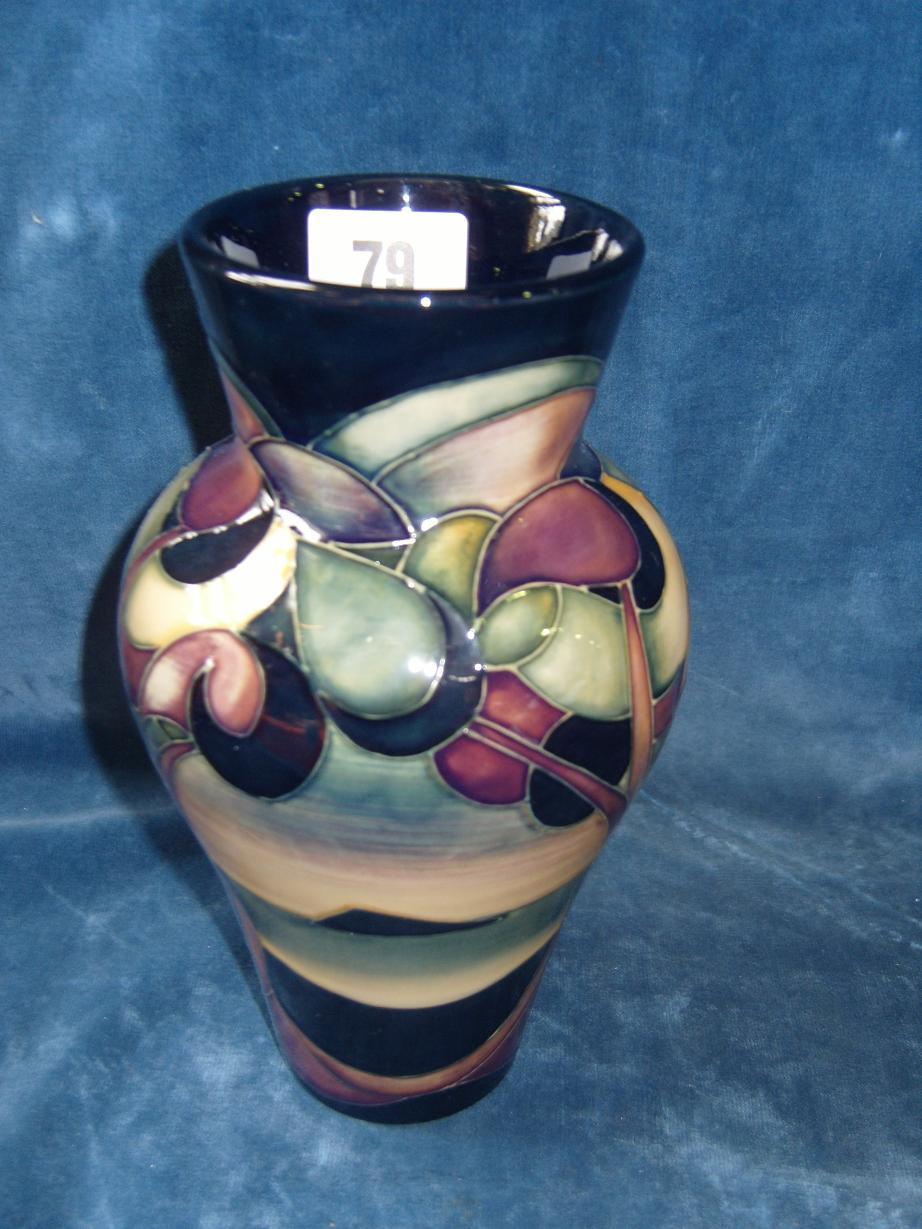 Appraisal: A Moorcroft vase with painted landscape and stylised tree decoration