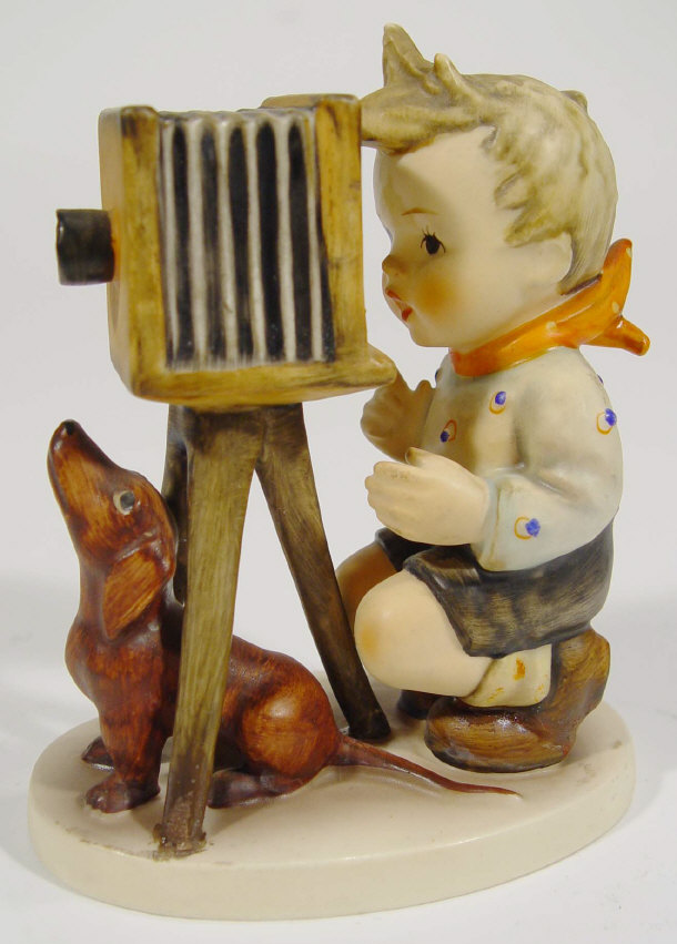 Appraisal: Hand painted Hummel figure of a boy with dog and