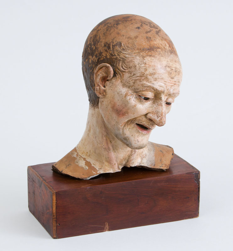 Appraisal: ITALIAN SCHOOL HEAD OF A MAN Painted terracotta modeled gazing