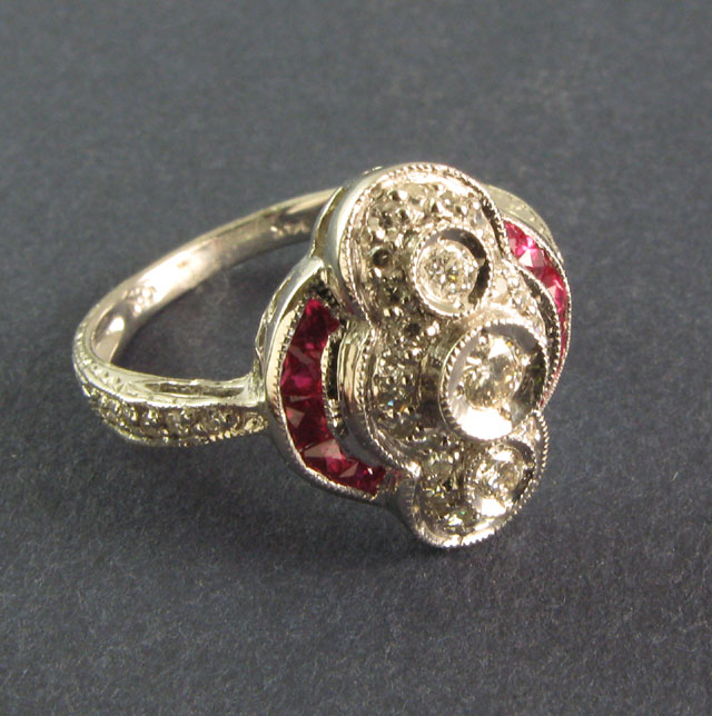 Appraisal: DIAMOND RUBY AND FOURTEEN KARAT GOLD RING set with round-cut