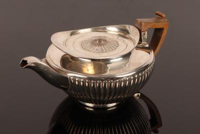 Appraisal: A George III silver teapot William Bennett London of compressed