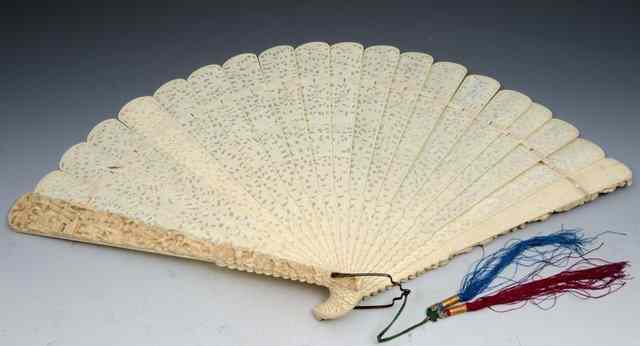 Appraisal: A CHINESE CANTON IVORY FAN carved and undercut with figures