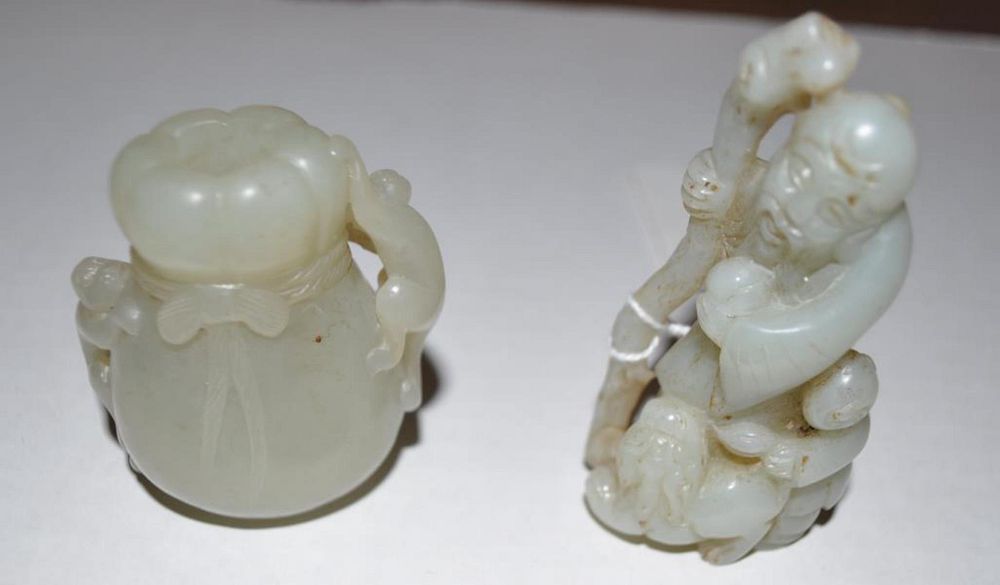 Appraisal: Two Chinese Jade Hardstone Carvings comprising a treasure sack and