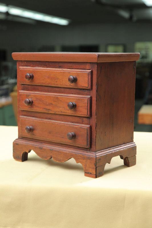 Appraisal: MINIATURE CHEST OF DRAWERS Pine having three graduated drawers with