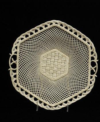 Appraisal: GRADUATED BELLEEK RETICULATED CAKE PLATE With woven basketweave center and